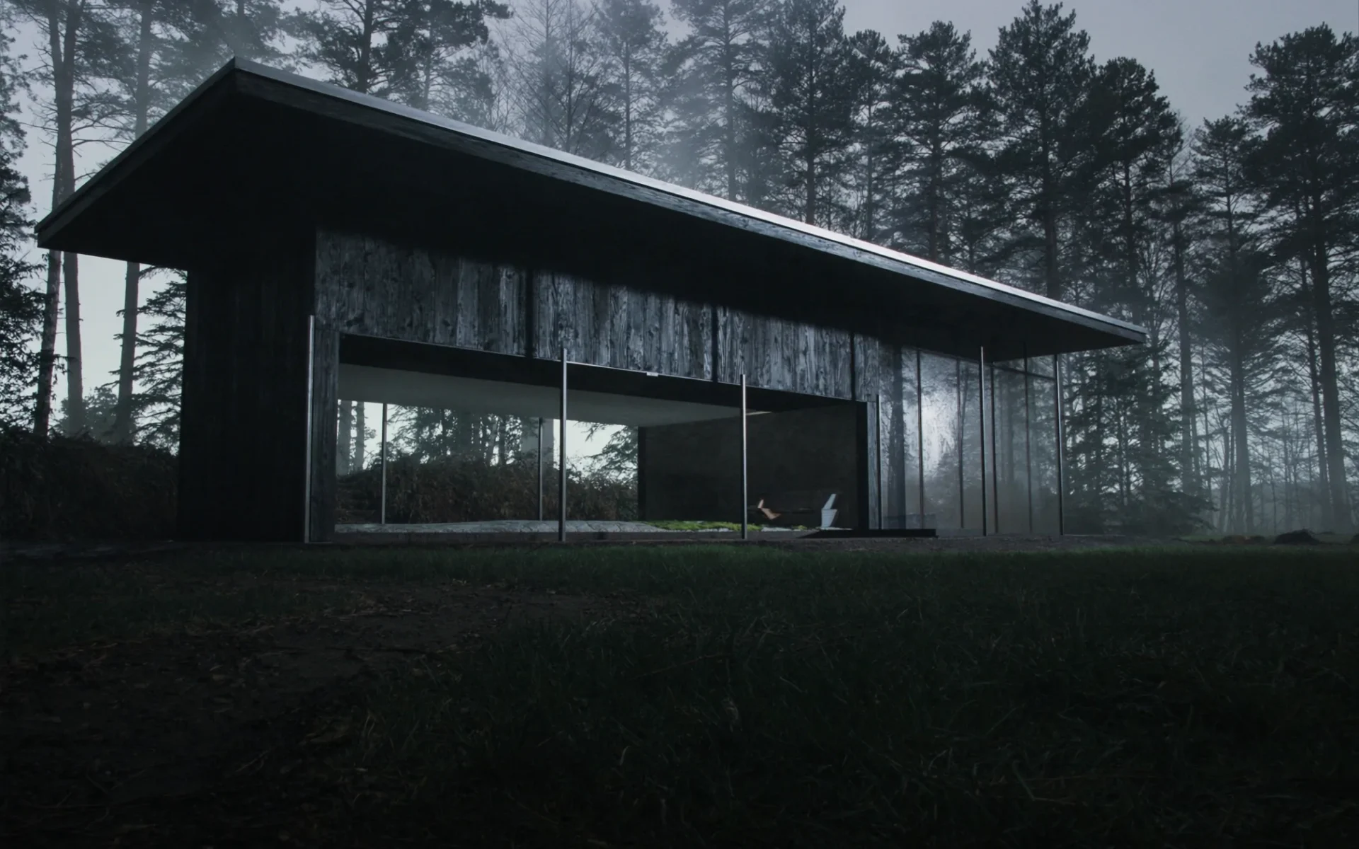 Casa de madera oscura integrada en un bosque de pinos